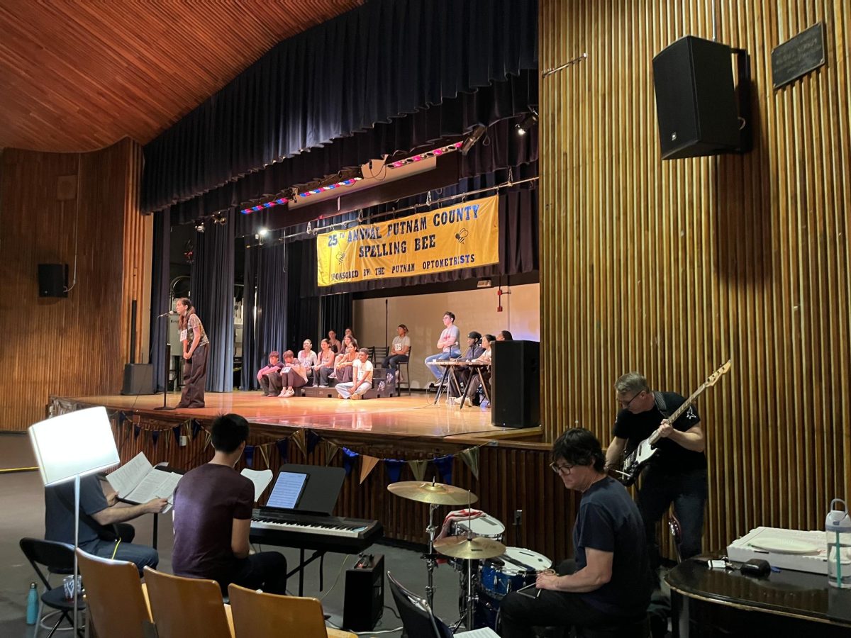 The band warms up for a dress rehearsal, featuring MBHS teachers, Mr. Wallin and Mr. Hamilton.